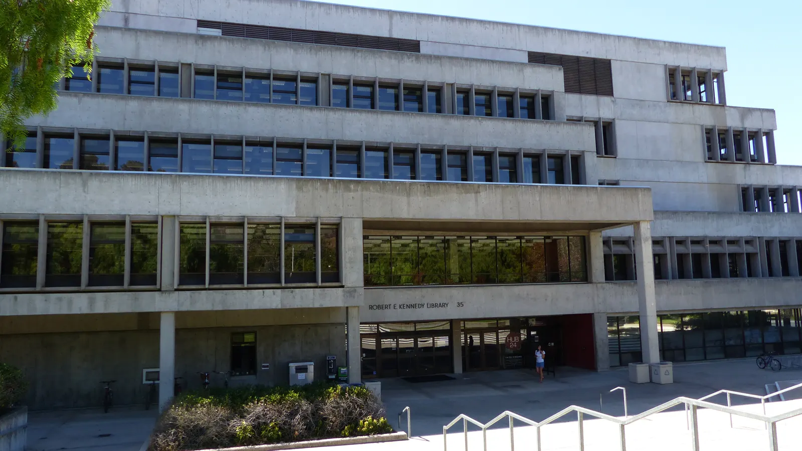 The Robert E. Kennedy Library above a lawn and stairs at Cal Poly in San Luis Obispo, California