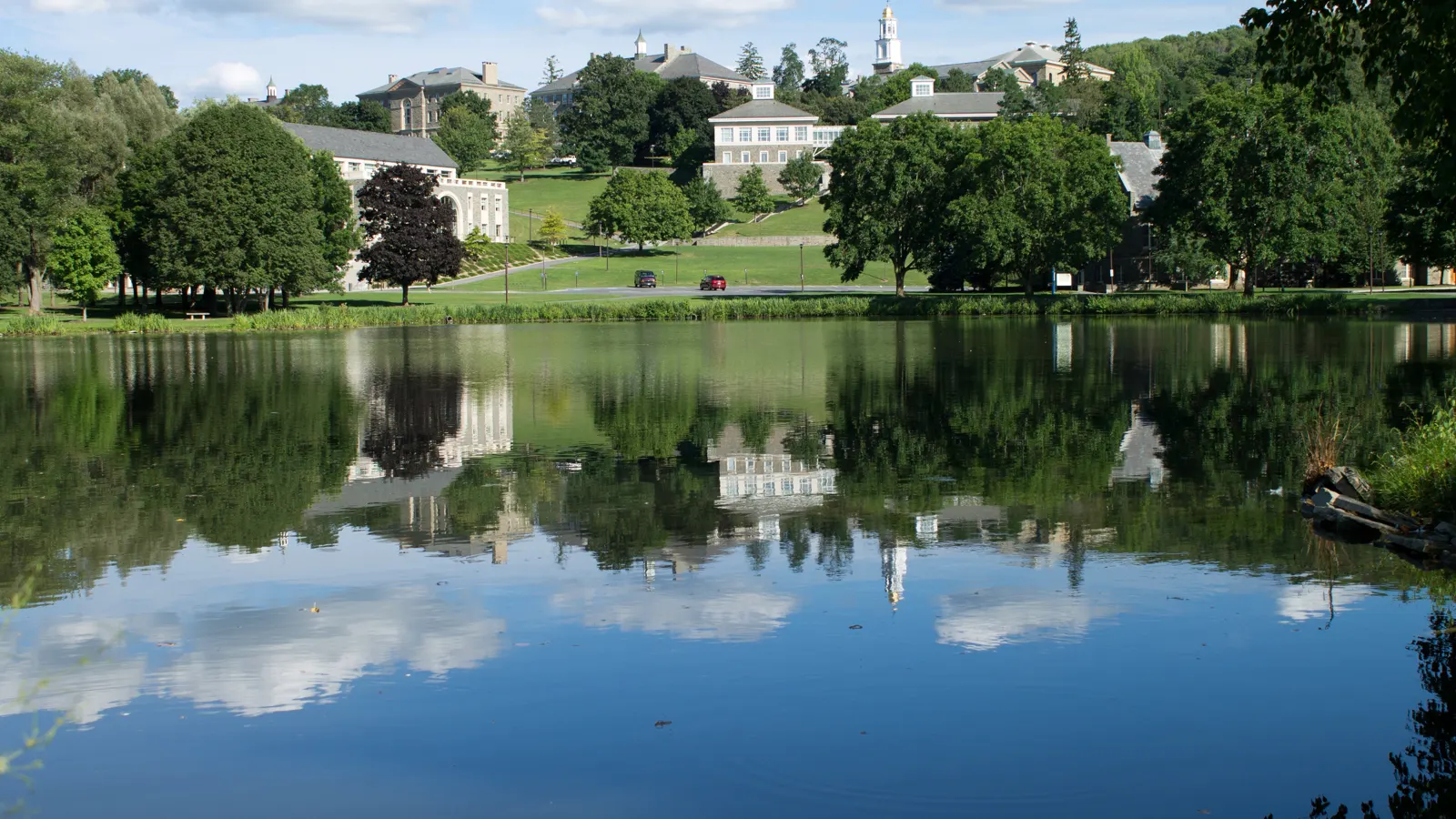 Colgate University buildings on the hill seen across Taylor Lake in Hamilton, New York