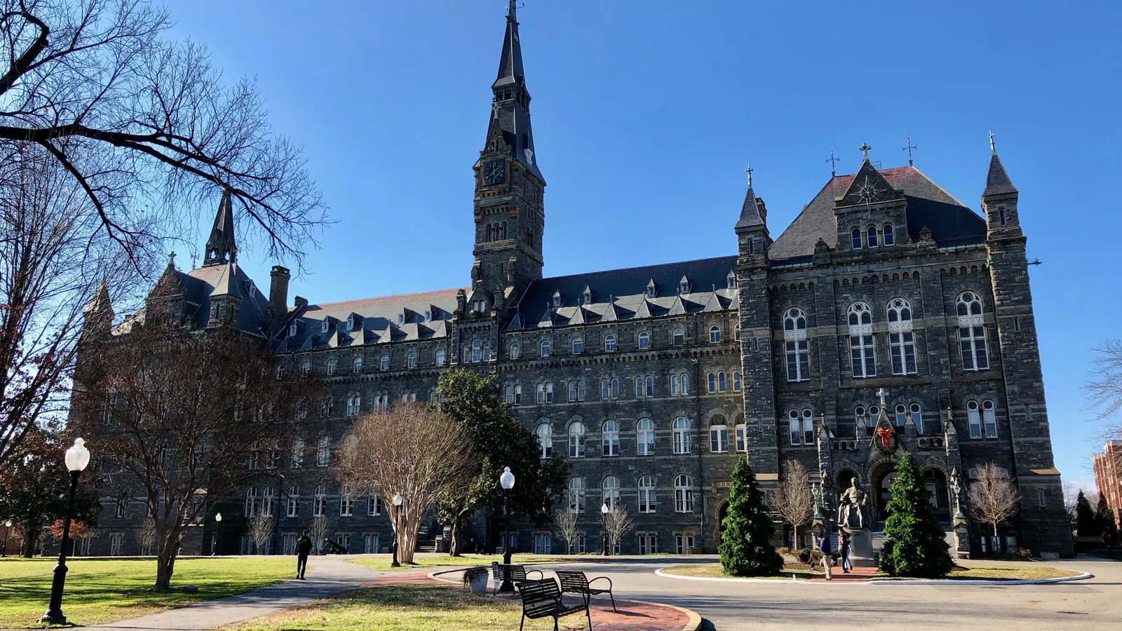 Healy Hall and its clock tower on the Georgetown University campus in Washington, DC, seen across the front lawn