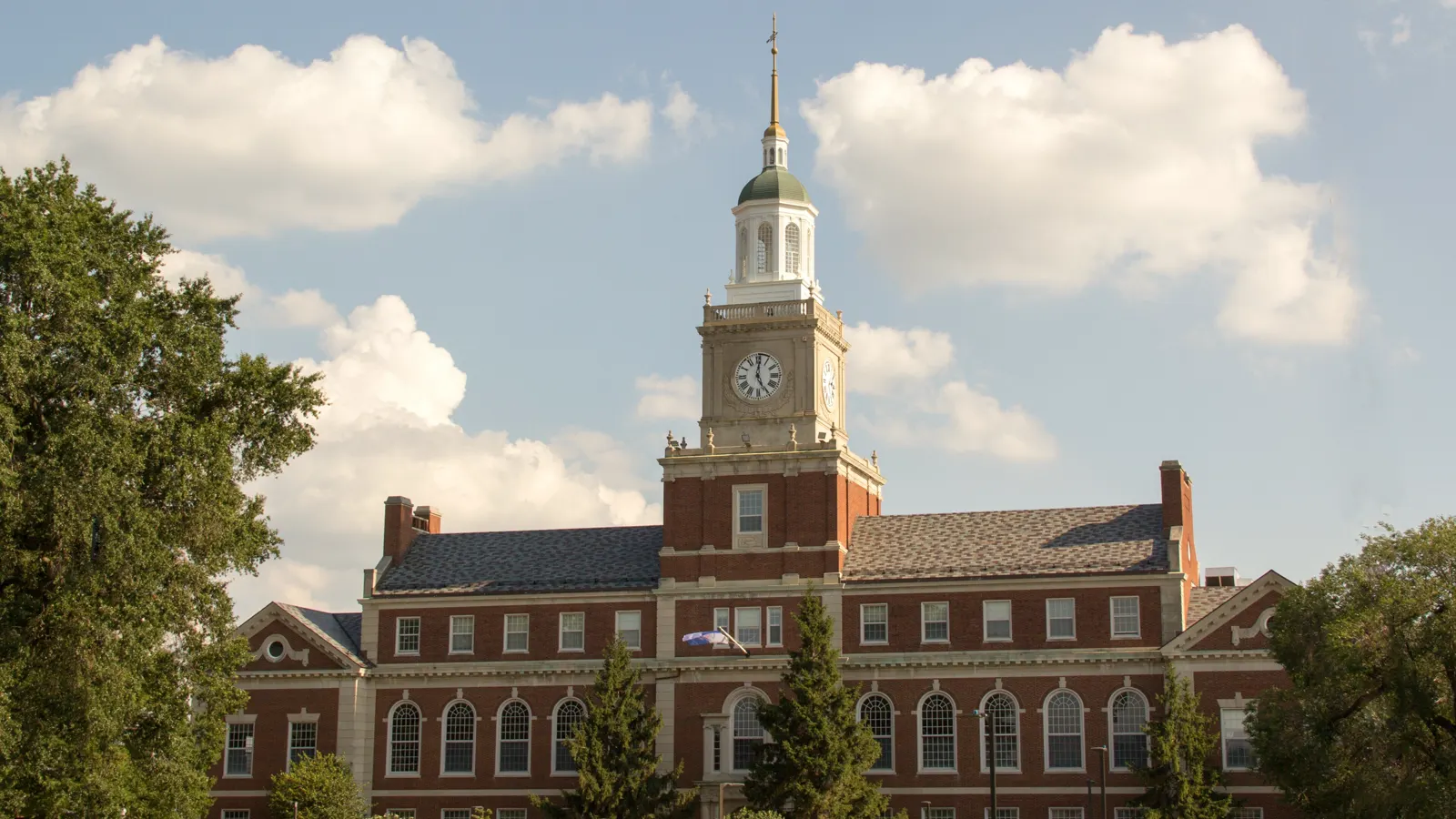 Founders Library and its white clock tower across the main quadrangle at Howard University in Washington, DC
