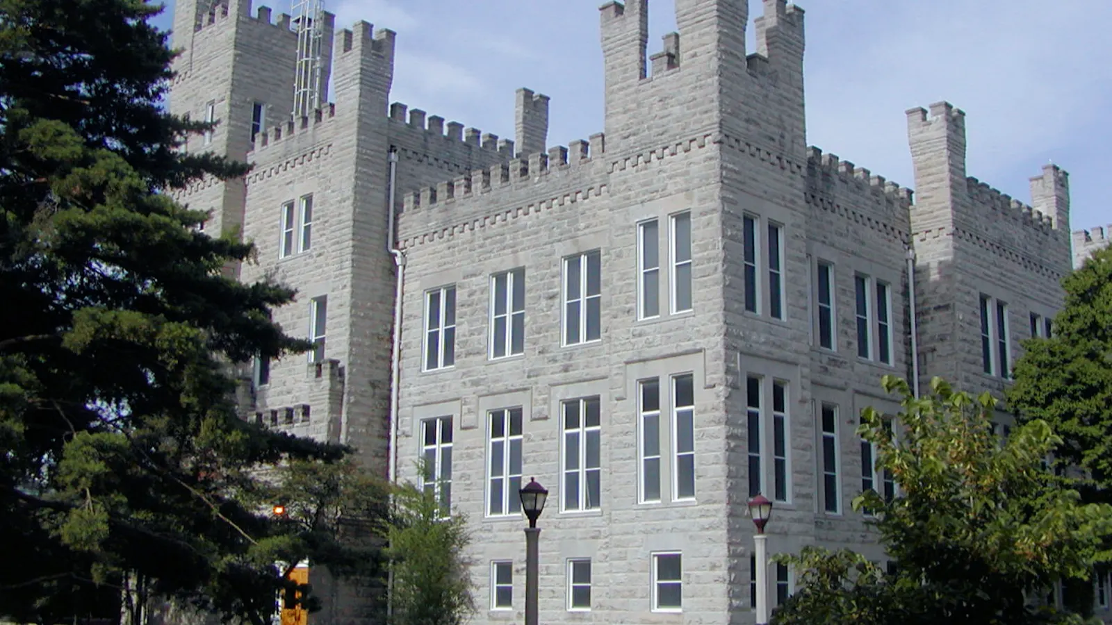 Cook Hall, a gray stone building with castle-style towers, on the Illinois State University campus