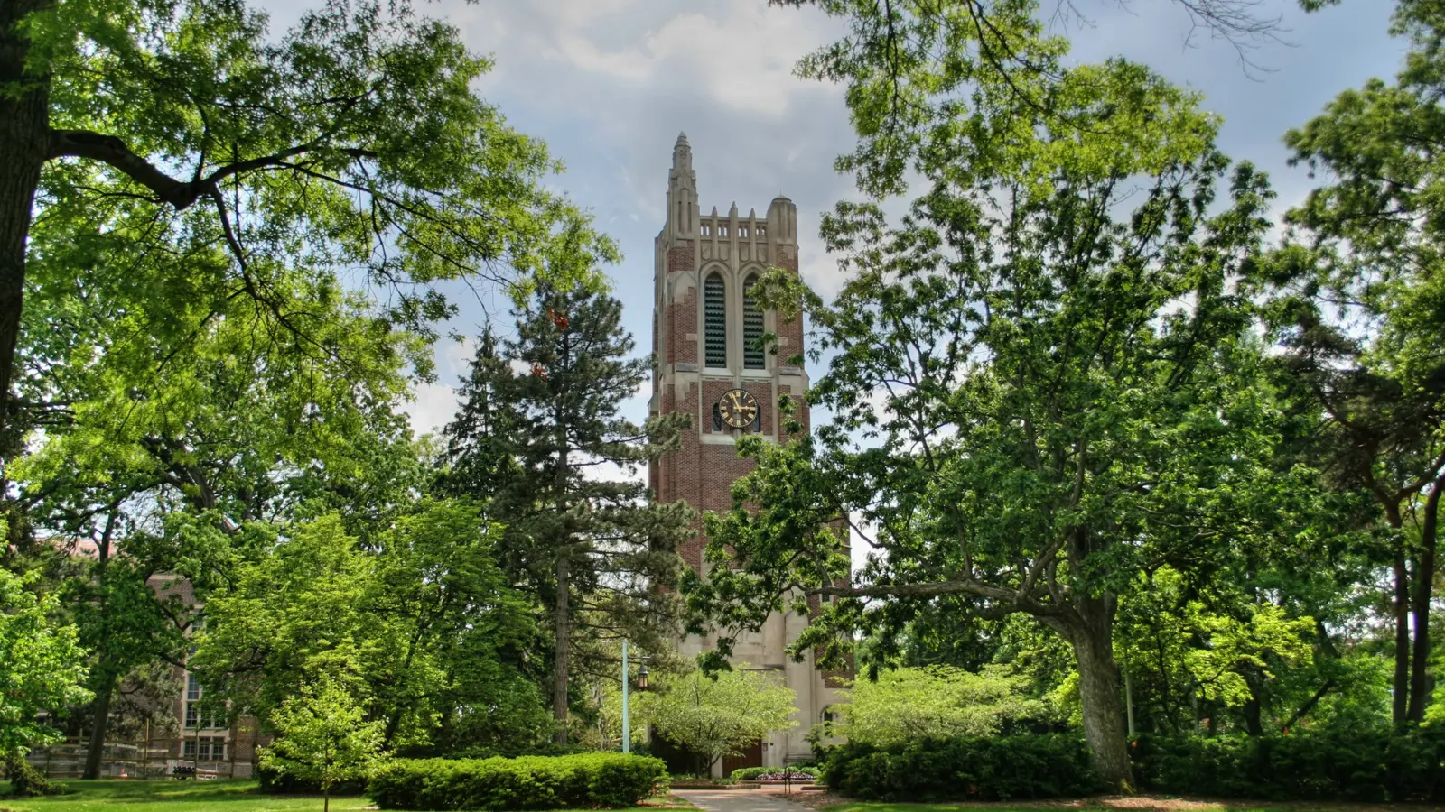Beaumont Tower among the trees on the Michigan State University campus in East Lansing, Michigan