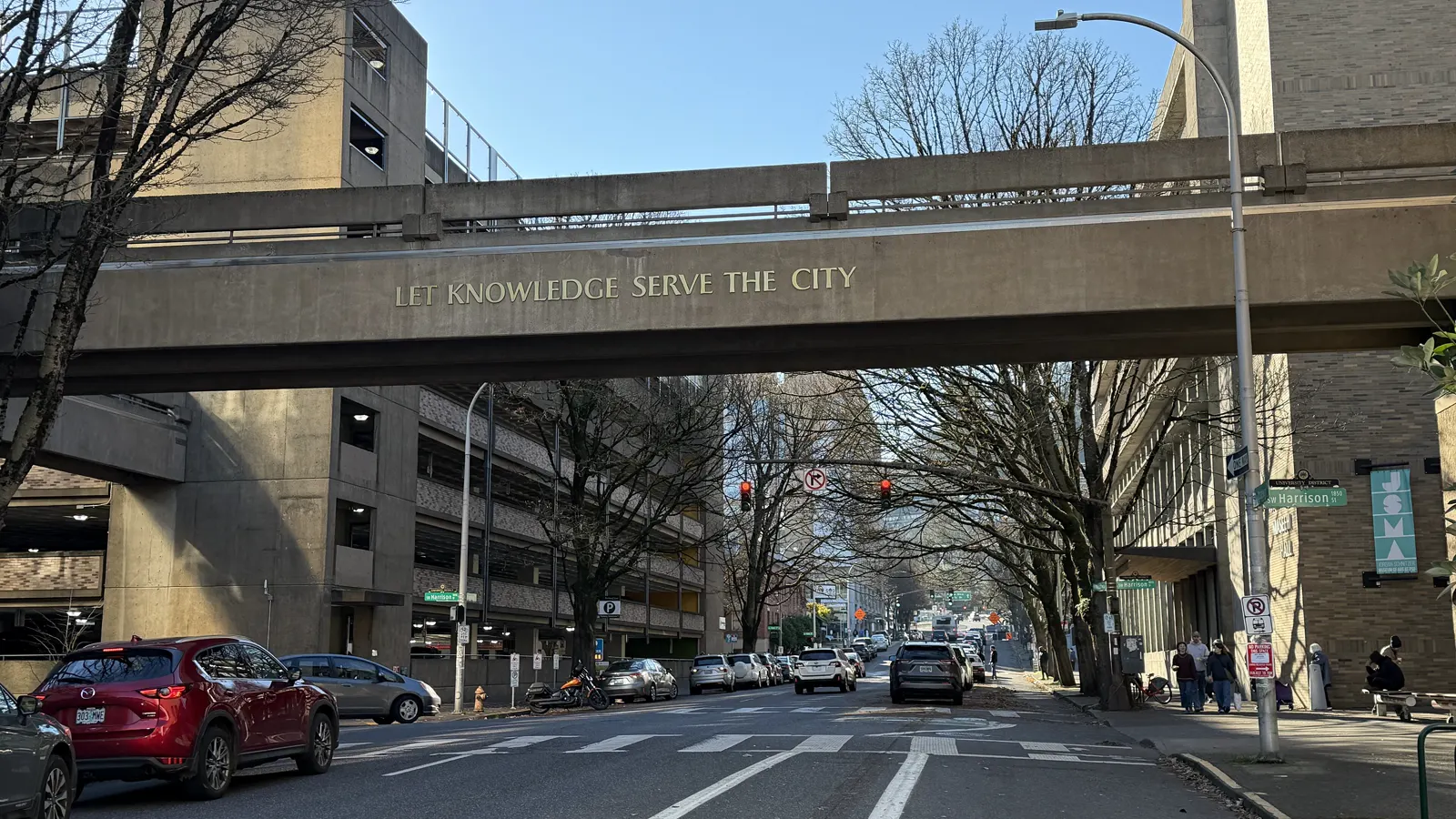 The Let Knowledge Serve the City skybridge over a street between Portland State University buildings in downtown Portland