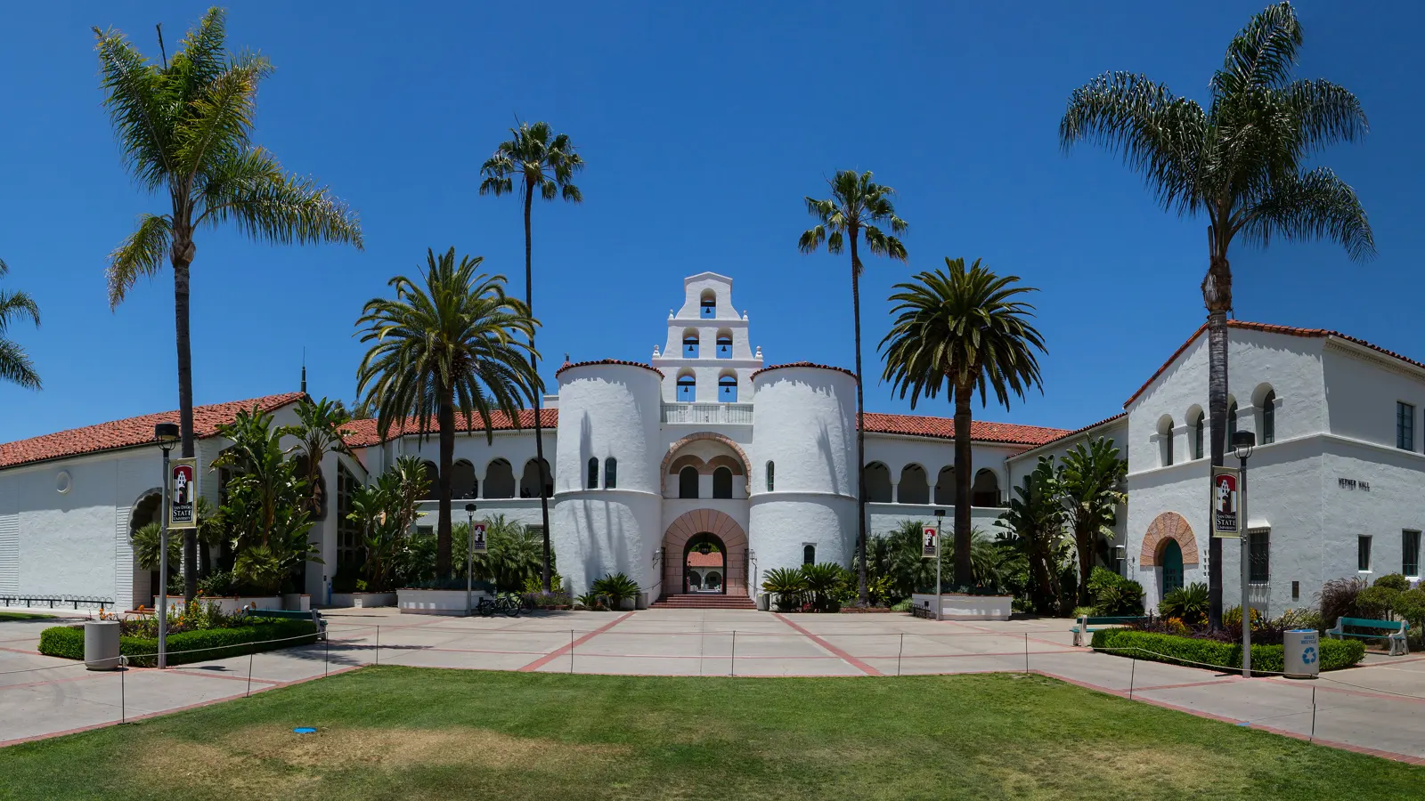 Hepner Hall and its tower among palm trees at San Diego State University