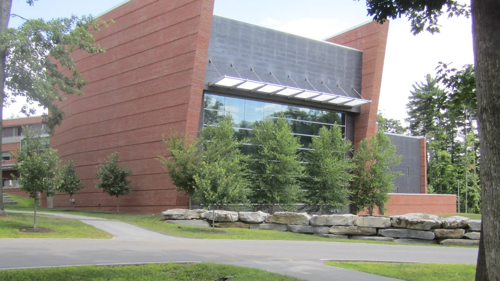 The Zankel Music Center, a brick and glass concert hall among trees at Skidmore College