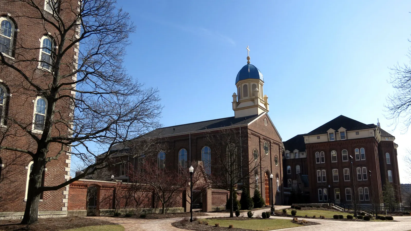 The blue-domed Chapel of the Immaculate Conception and brick halls on the University of Dayton campus in Ohio