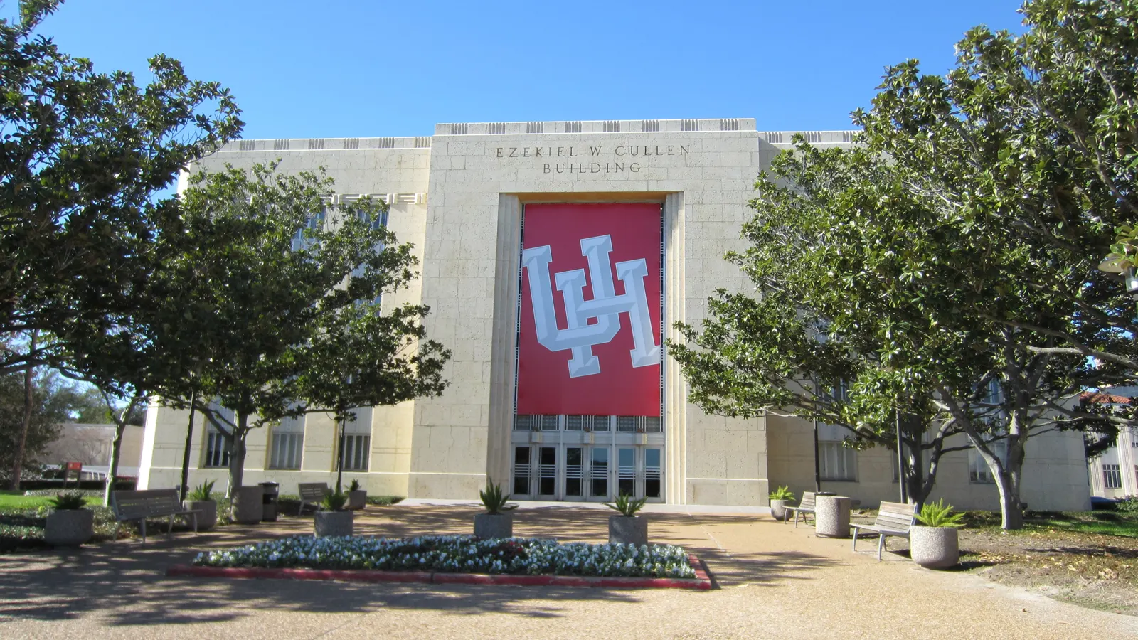 The Ezekiel W. Cullen Building framed by trees on the University of Houston campus in Houston, Texas
