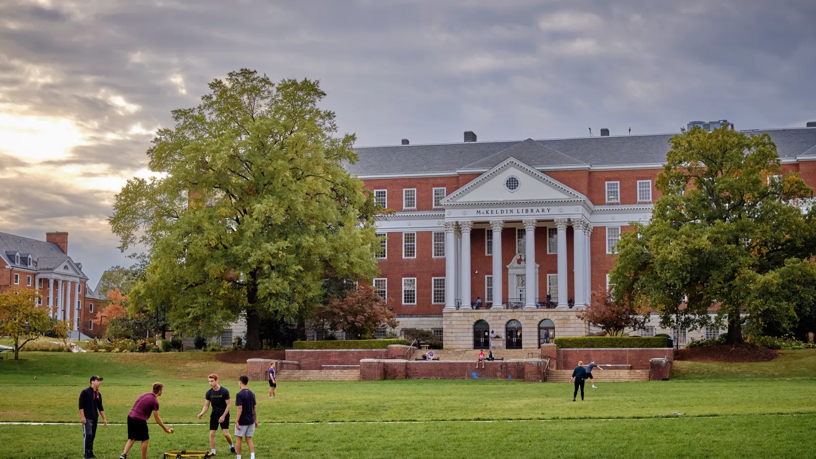 McKeldin Library, a red brick building with a white columned portico, across the lawn of McKeldin Mall at the University of Maryland
