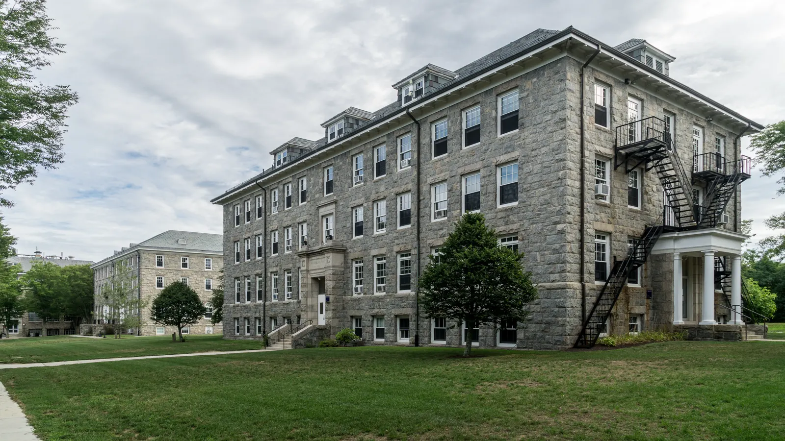 East Hall and Washburn Hall, granite buildings beside a lawn at the University of Rhode Island in Kingston