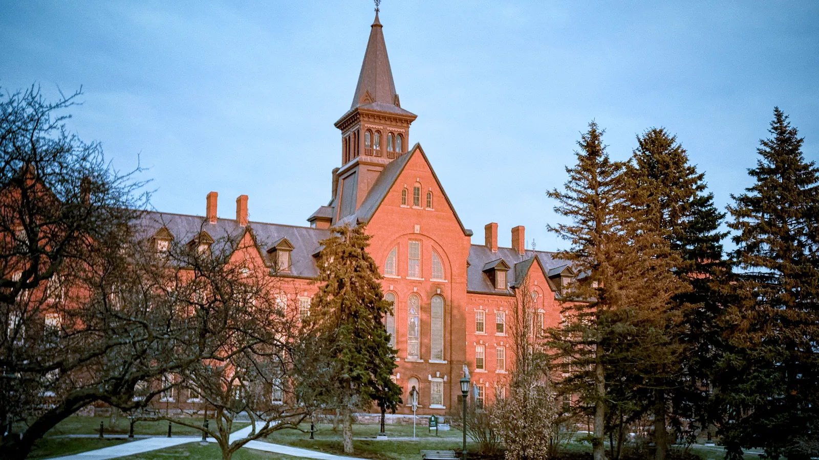 The red brick Old Mill building and its tower above the University Green at the University of Vermont in Burlington