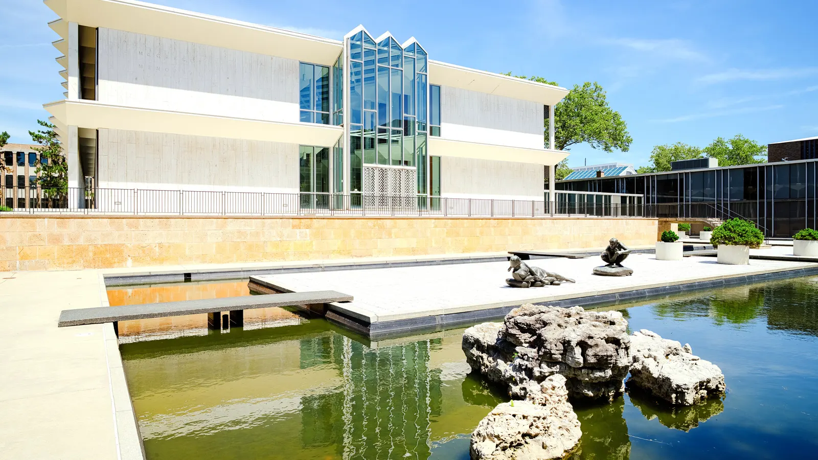The McGregor Memorial Conference Center beside its reflecting pool and sculptures on the Wayne State University campus in Detroit, Michigan